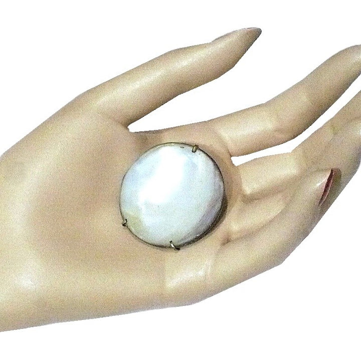 1950s Natural Silver-lipped Pearl Oyster Brooch in hand.