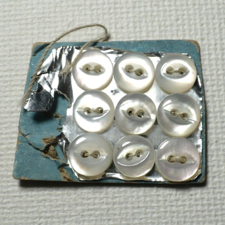 9L Two Hole Fish Eye Pearl Diminutive Buttons