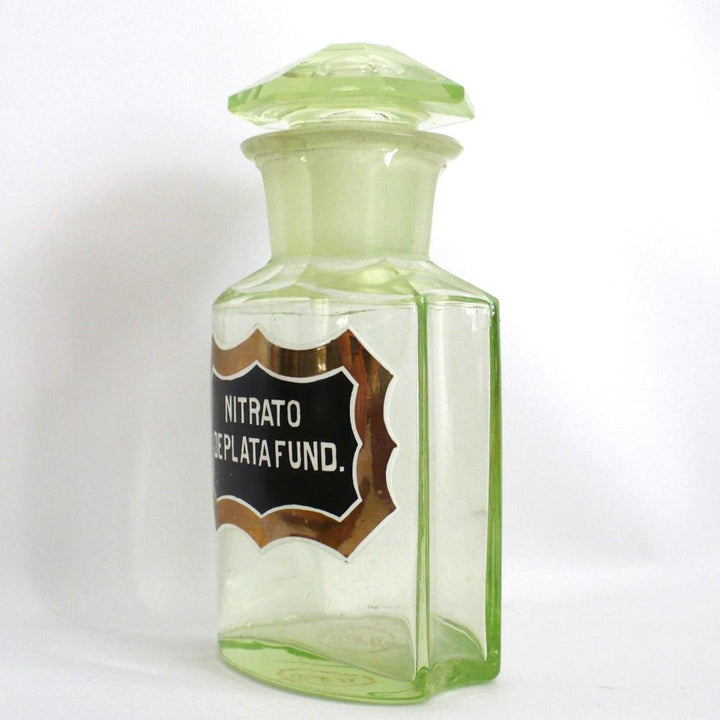 Uranium glass apothecary bottle under regular light.