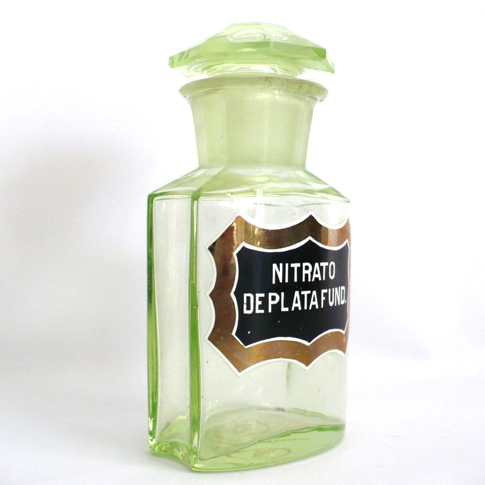 Uranium glass apothecary bottle under regular light.