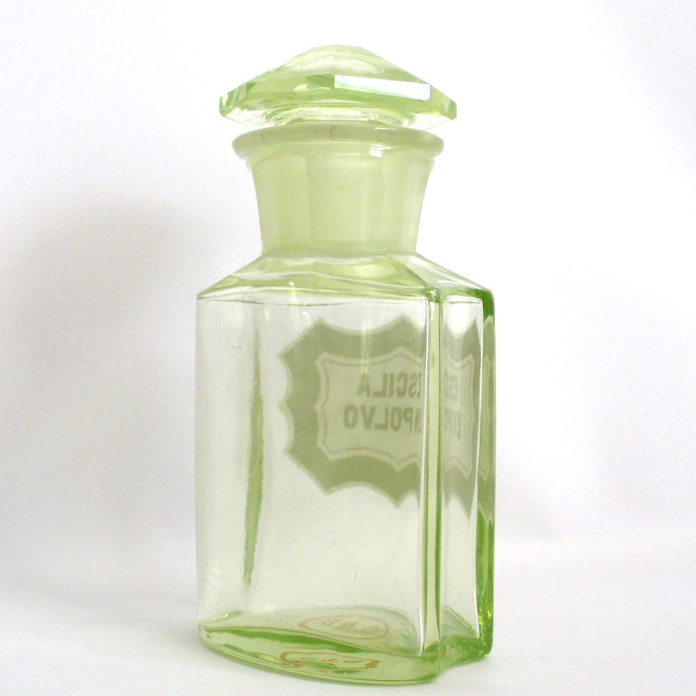 Uranium glass apothecary bottle under regular light.