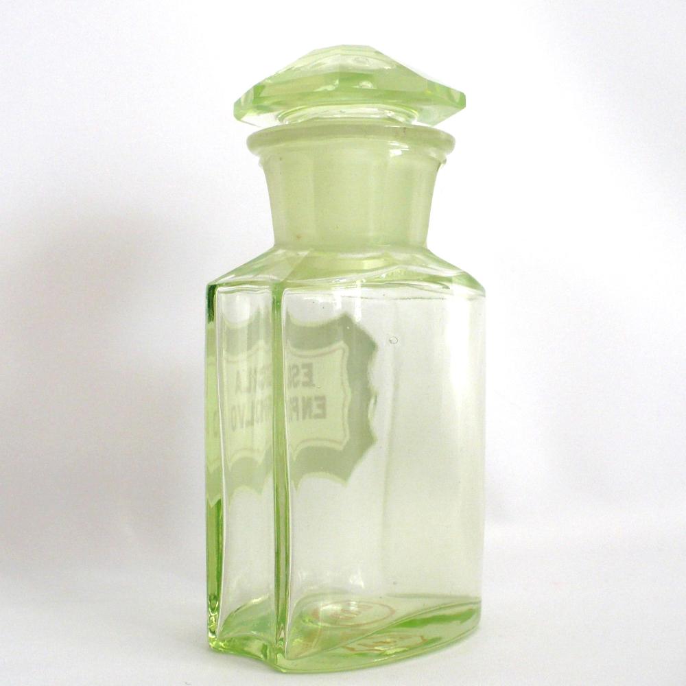 Uranium glass apothecary bottle under regular light.