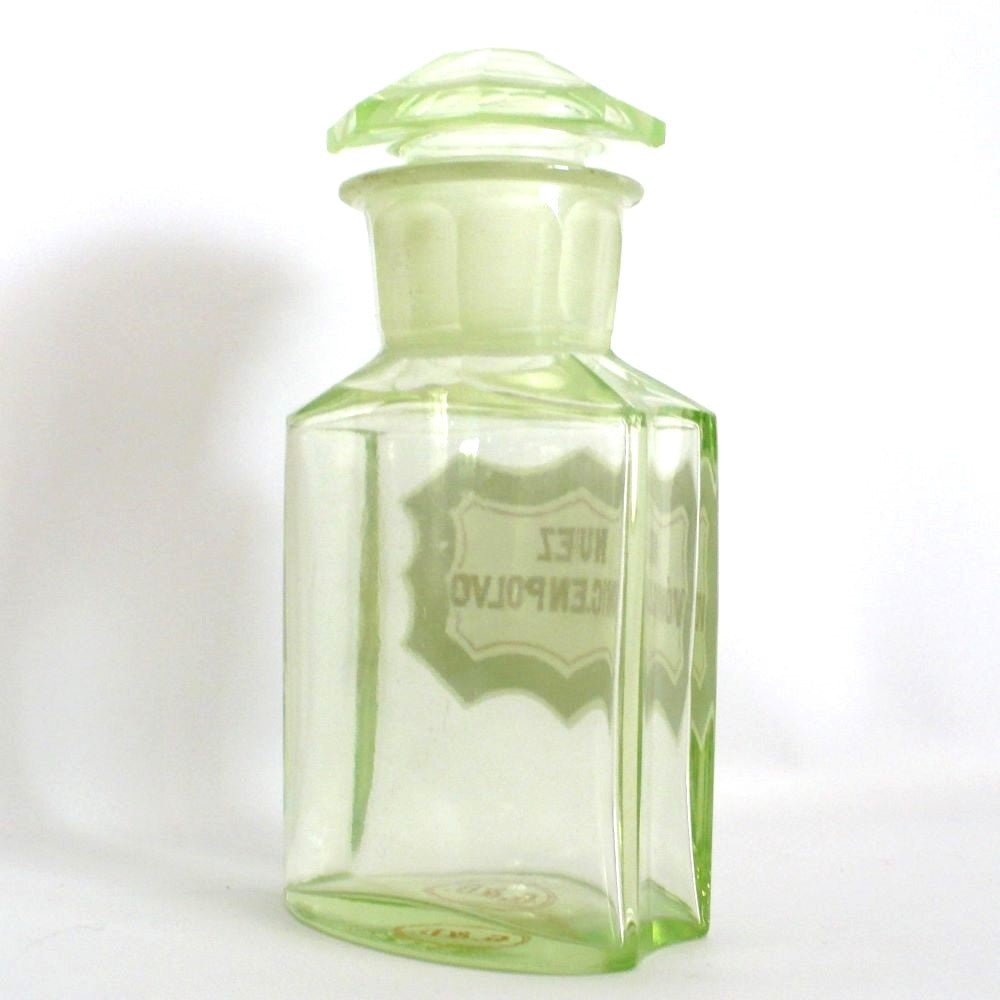 Uranium glass apothecary bottle under regular light.