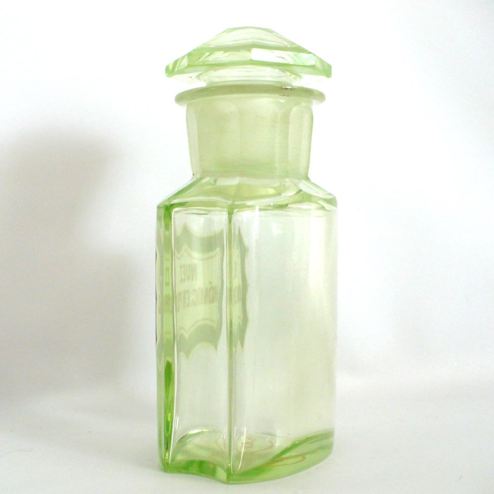 Uranium glass apothecary bottle under regular light.