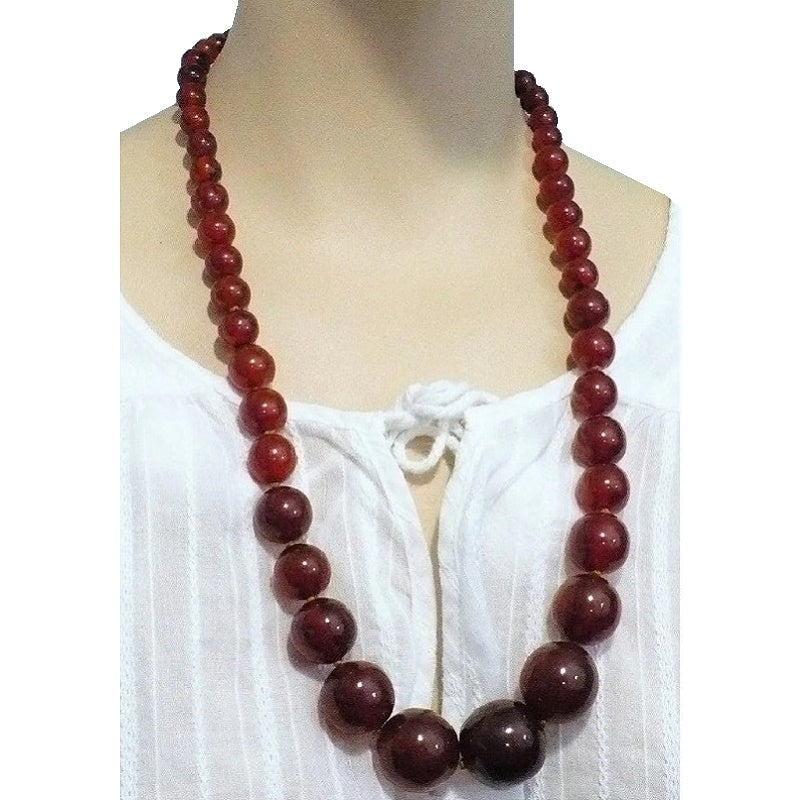 Imitation amber lucite bead necklace.