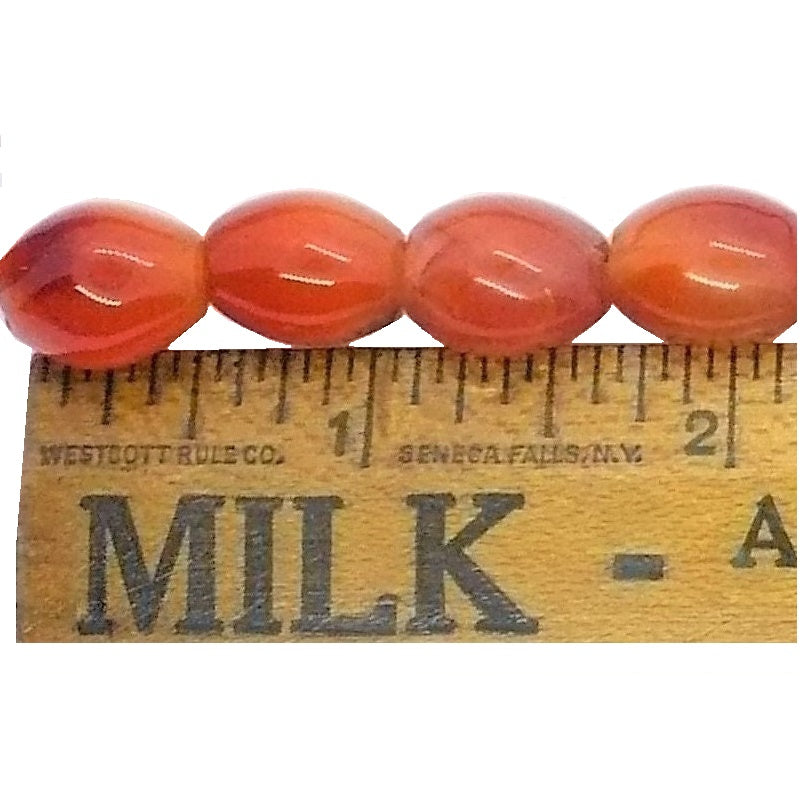 1980s Classic Carnelian Beaded Necklace 18 inches long shown next to a ruler to illustrate the size scale of the beads. 