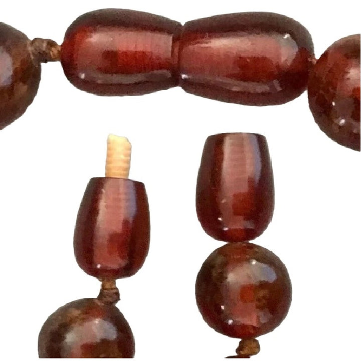 Genuine amber necklace functioning clasp shows tiny chips at open tip, and also securely closed